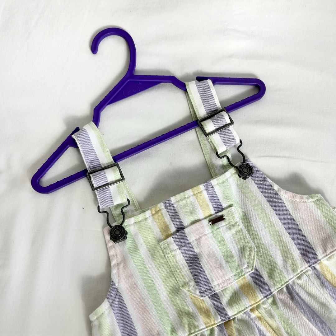 ( r e ) ˣ kids purple hanger holding a striped pastel set of overalls