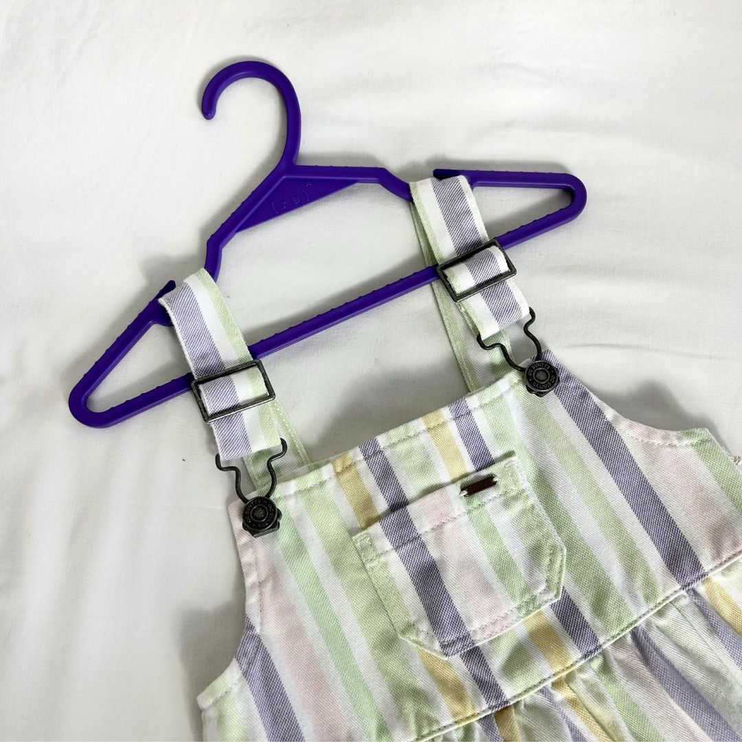 ( r e ) ˣ kids purple hanger holding a striped pastel set of overalls